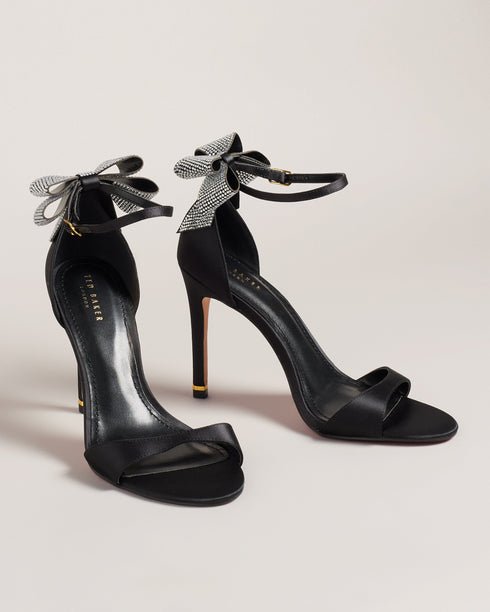 HEMARY-Sandals-We've made the perfect party shoe with HEMARY. With a stiletto heel and crystal embellished bow at the back, these satin sandals are as elegant as they are daring. Slip into the slim open toe strap and secure the buckle ankle fastening, and you're ready to dance the night away. Heeled sandals Satin finish Crystal bow embellishment Open toe Slim toe strap Stiletto heel with golden detail Buckle ankle strap- Ted Baker Romania